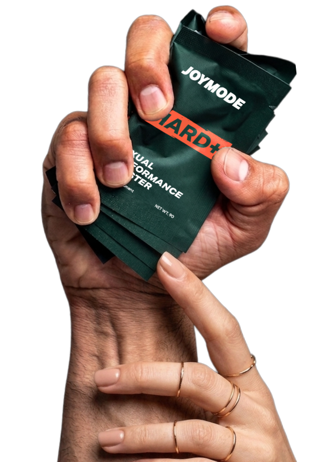 A hand holding HARD+ sachets